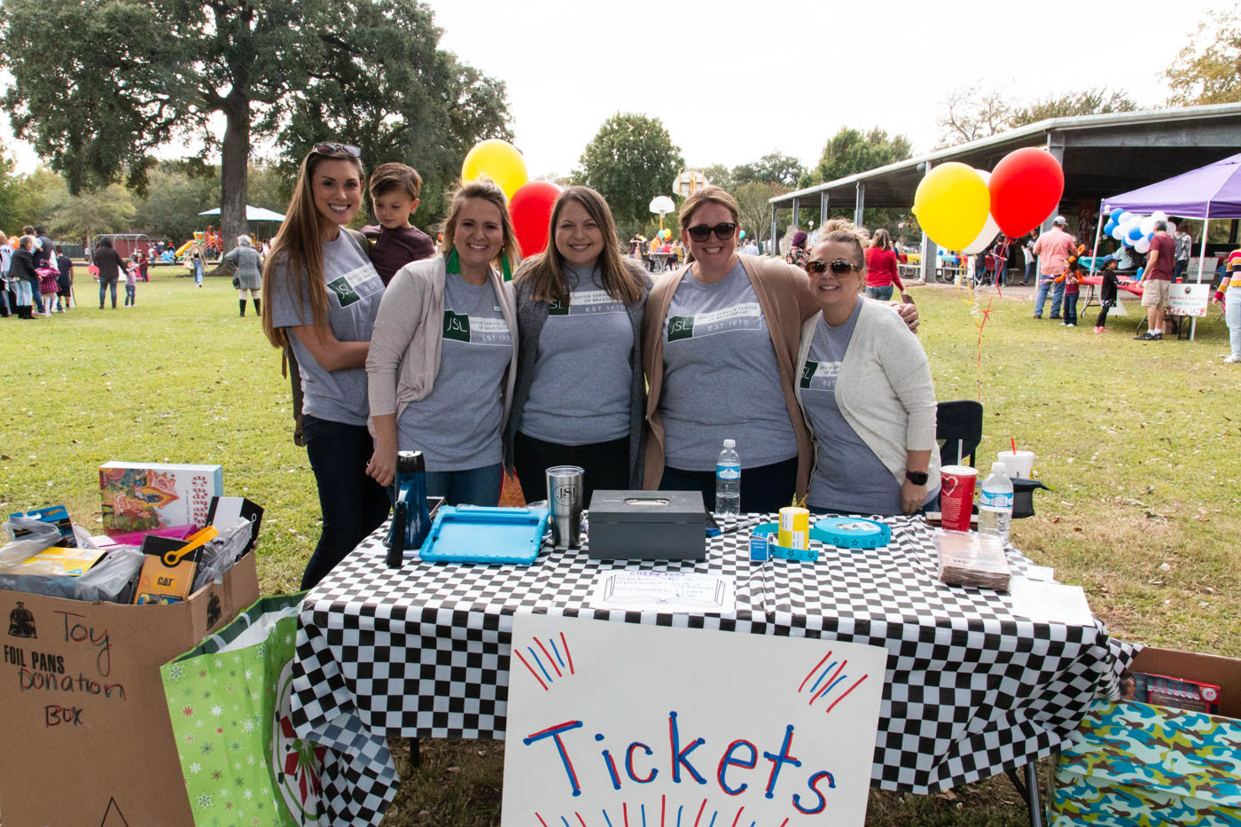 Kaley Crisp, Crew Crisp, Kelsey Beach, Melissa Blanks, Nicole Larson, and Brittany Figaro pose at the ticket stand at the Teddy Bear Carnival. The Teddy Bear Carnival was held at Clute Municipal Park on November 17, 2019. The Carnival was held to raise money and donations for Blue Santa.