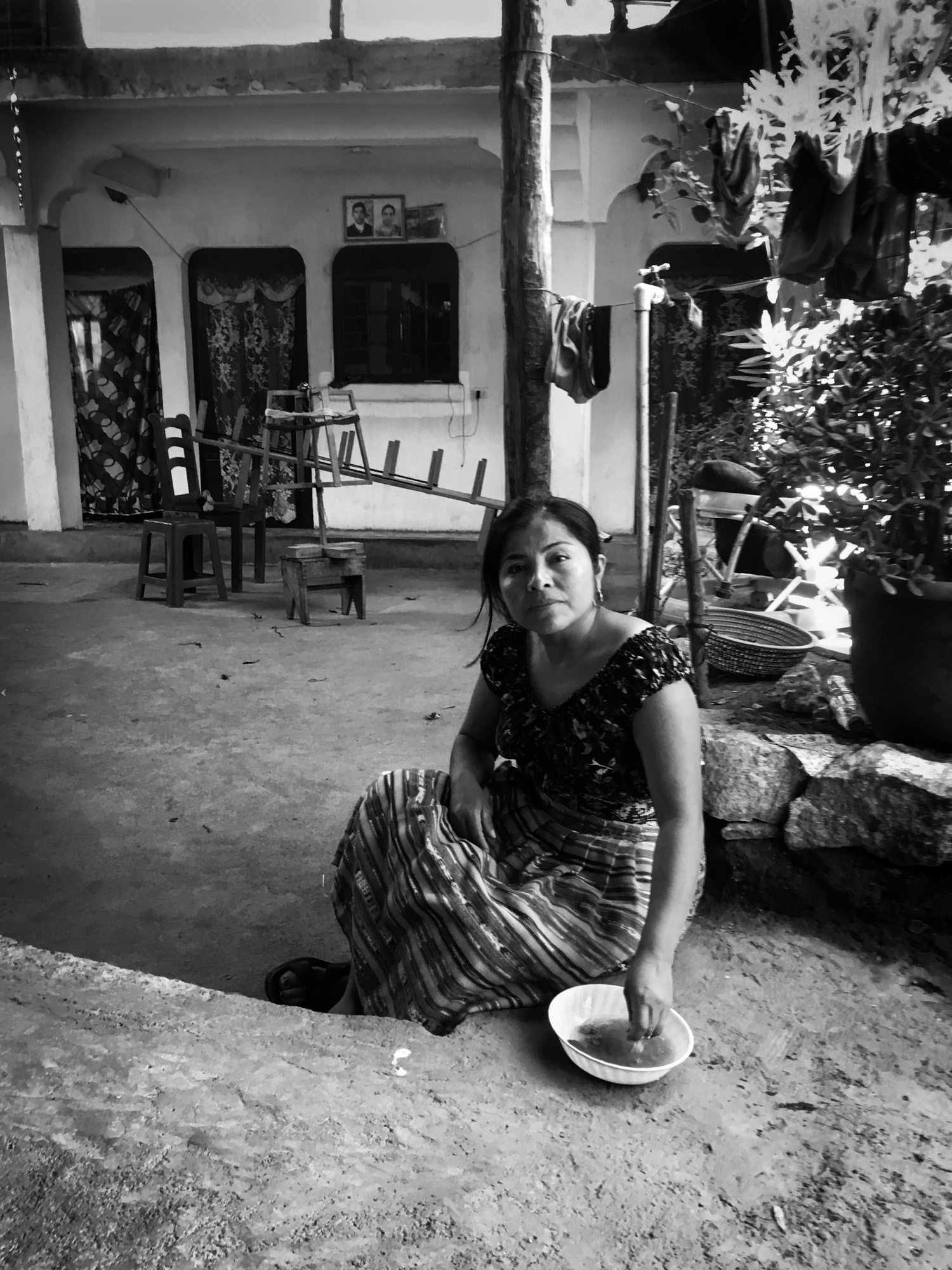Chusita preparing wash of masa for threads