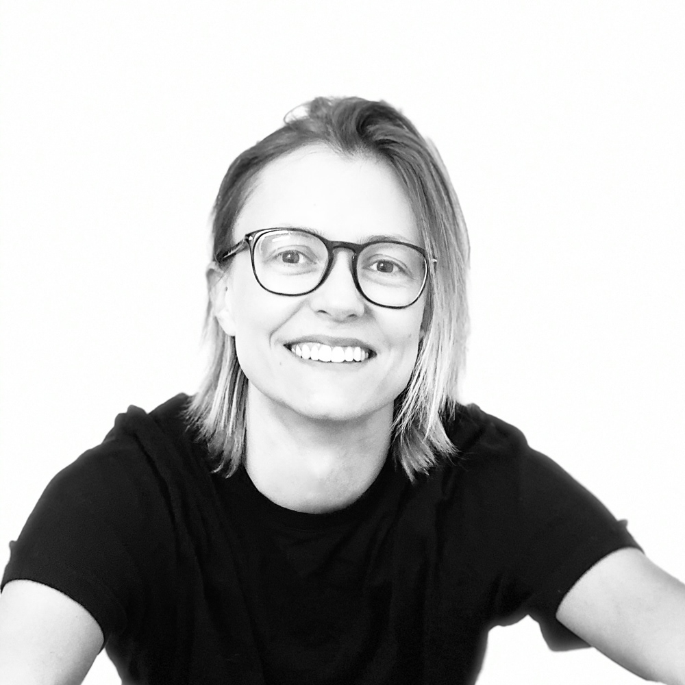 Black and white photo of smiling women with glasses