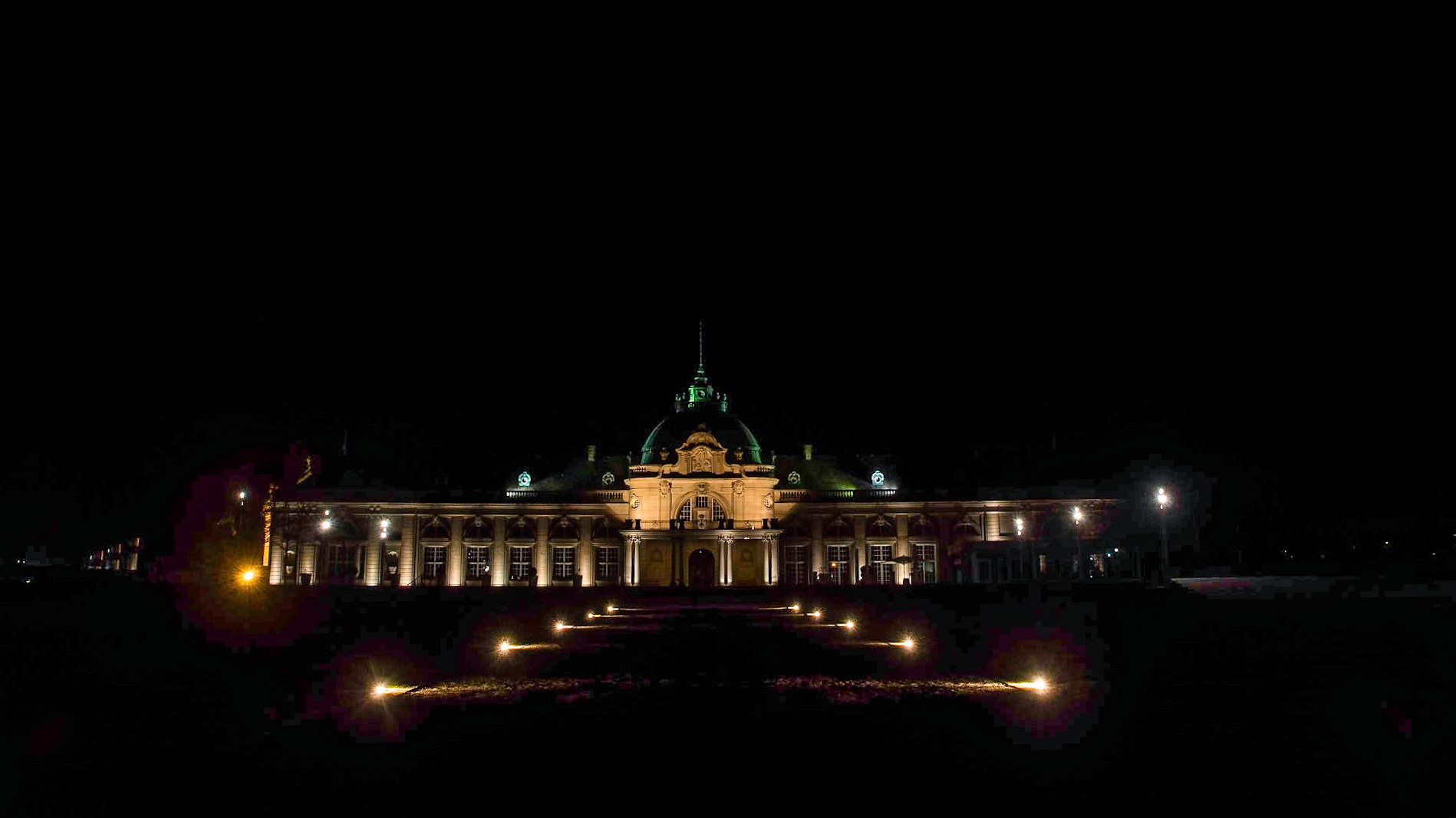 The Georgspalast (GOP) illuminated at night.