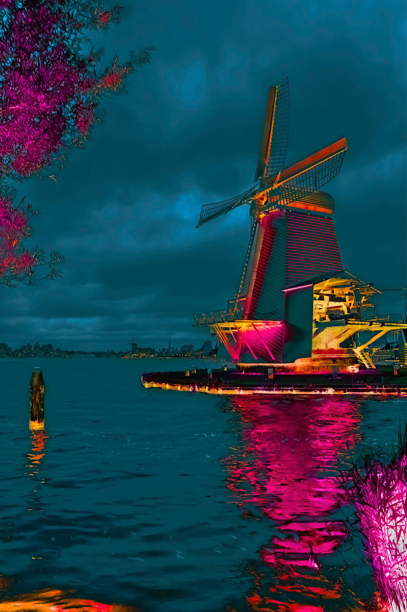 Color Mill against a dark clouded sky