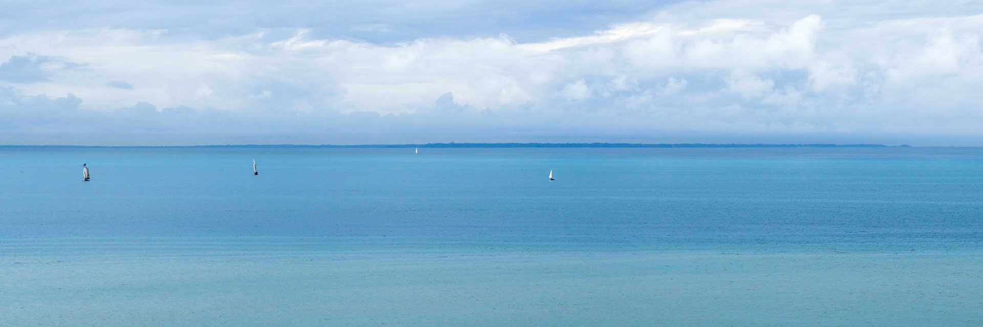 Four little boats on the English Channel at Cap Lihou in Granville,