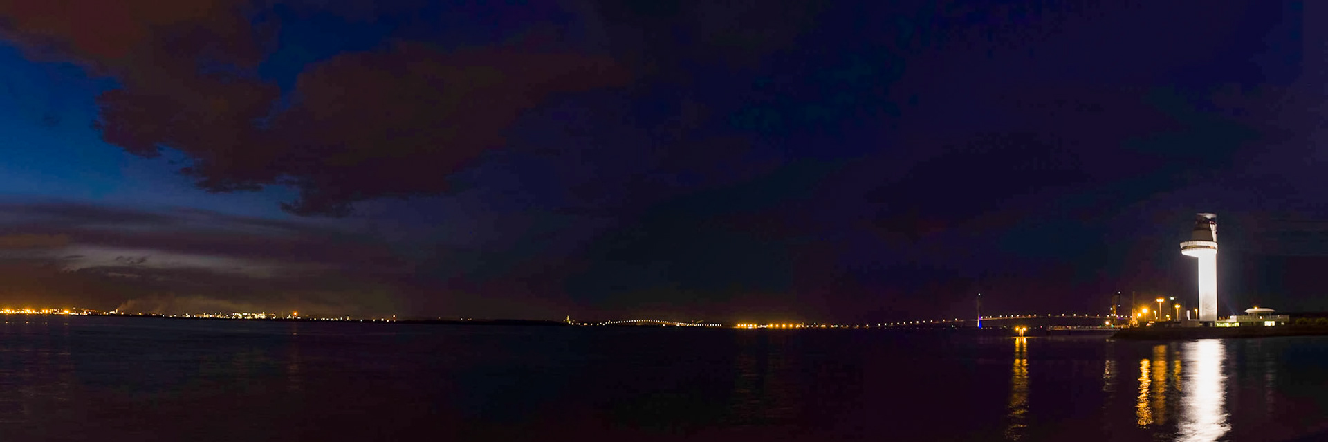 Nightview on the famous Pont de Normandie from Honfleur. The second bridge further away is the one over the 'Grand Canal du Havre'.