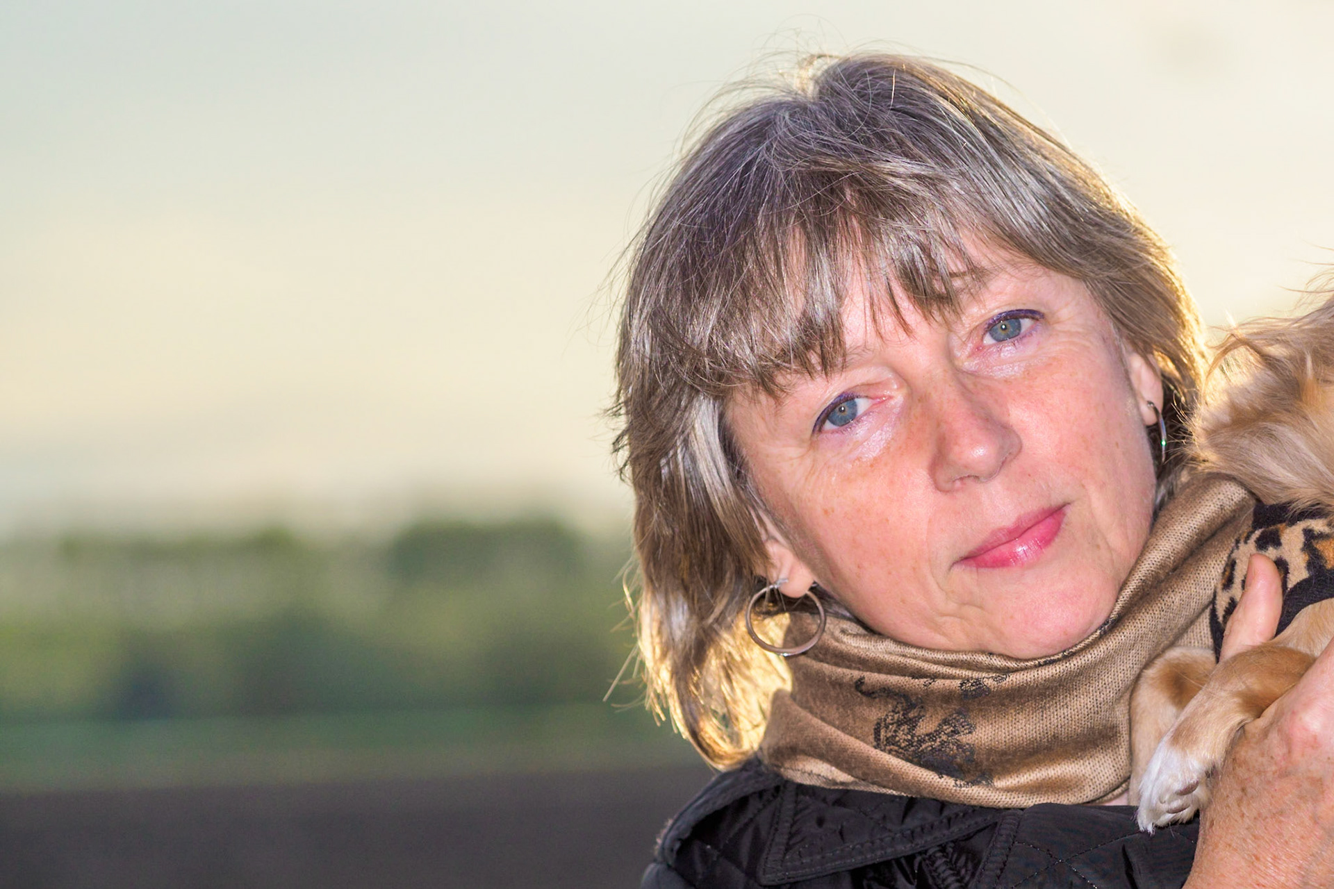 Adult female tilted head close-up outdoor portrait
