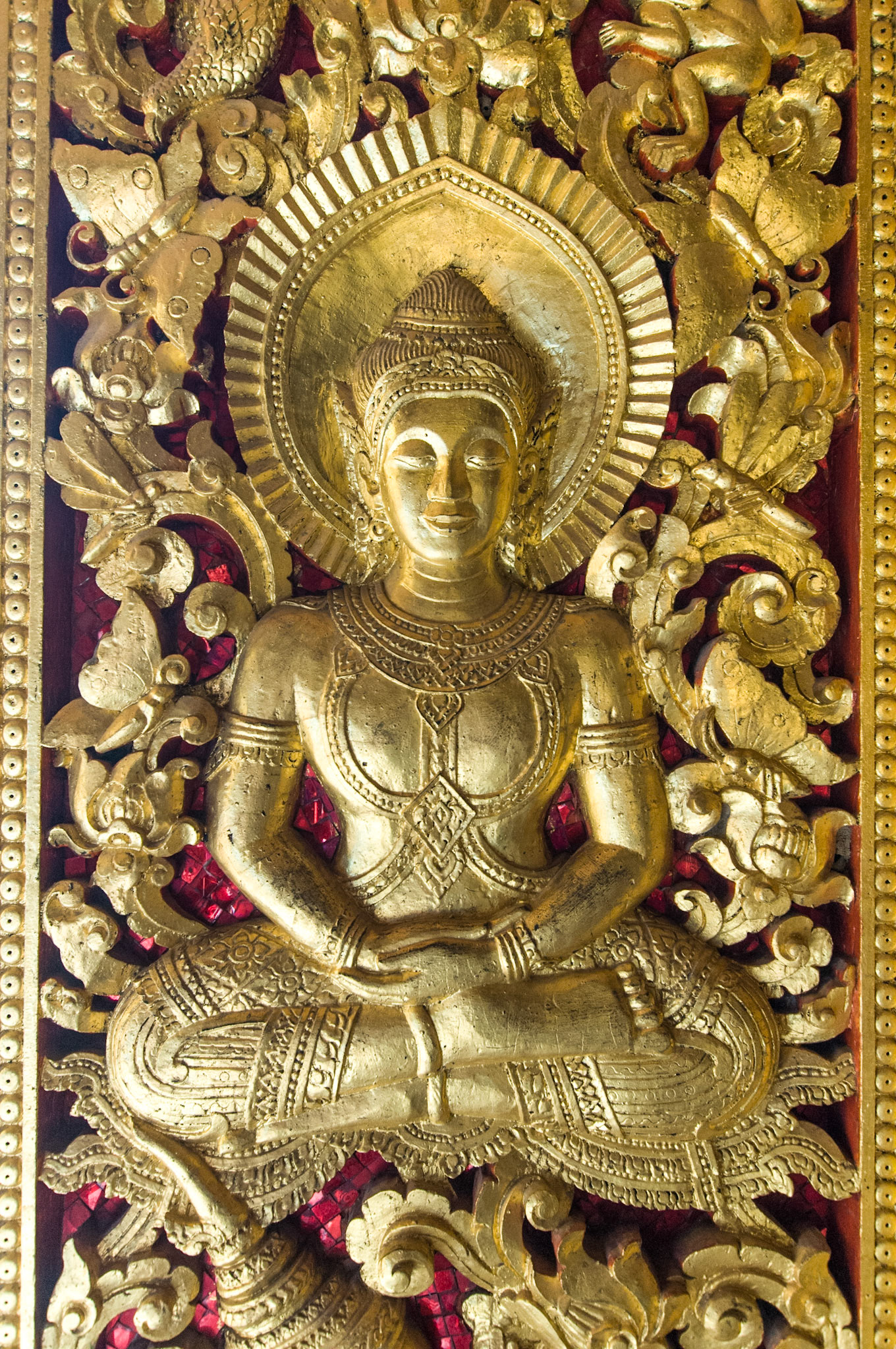 Laos, Luang Prabang, Wat Visoun, detail of golden door