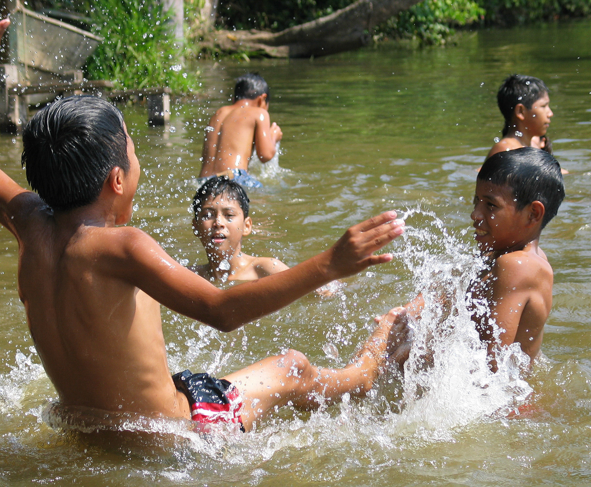 Kids on a school trip swimming in Lake Sandoval in the Amazon Rain Forest. Peru is such a multifaceted country: from the Andes to the Amazon in just one hour by plane.