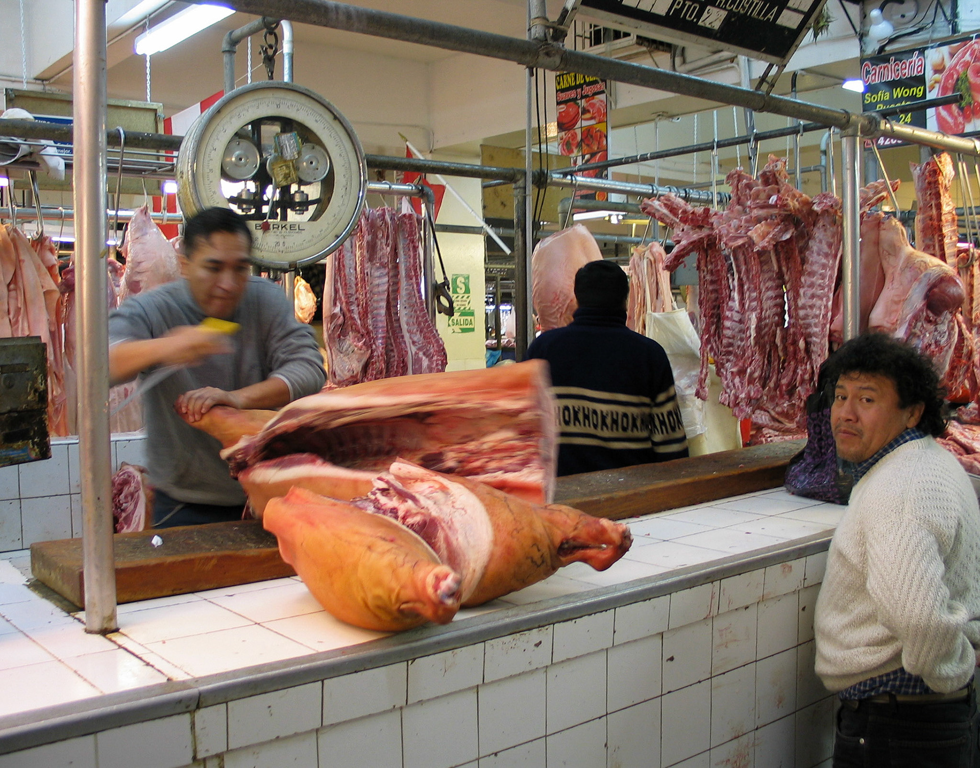 A butcher chops a pork at the central market in Lima. I beleive markets are the most interesting places one can visit to understand a country and its people.