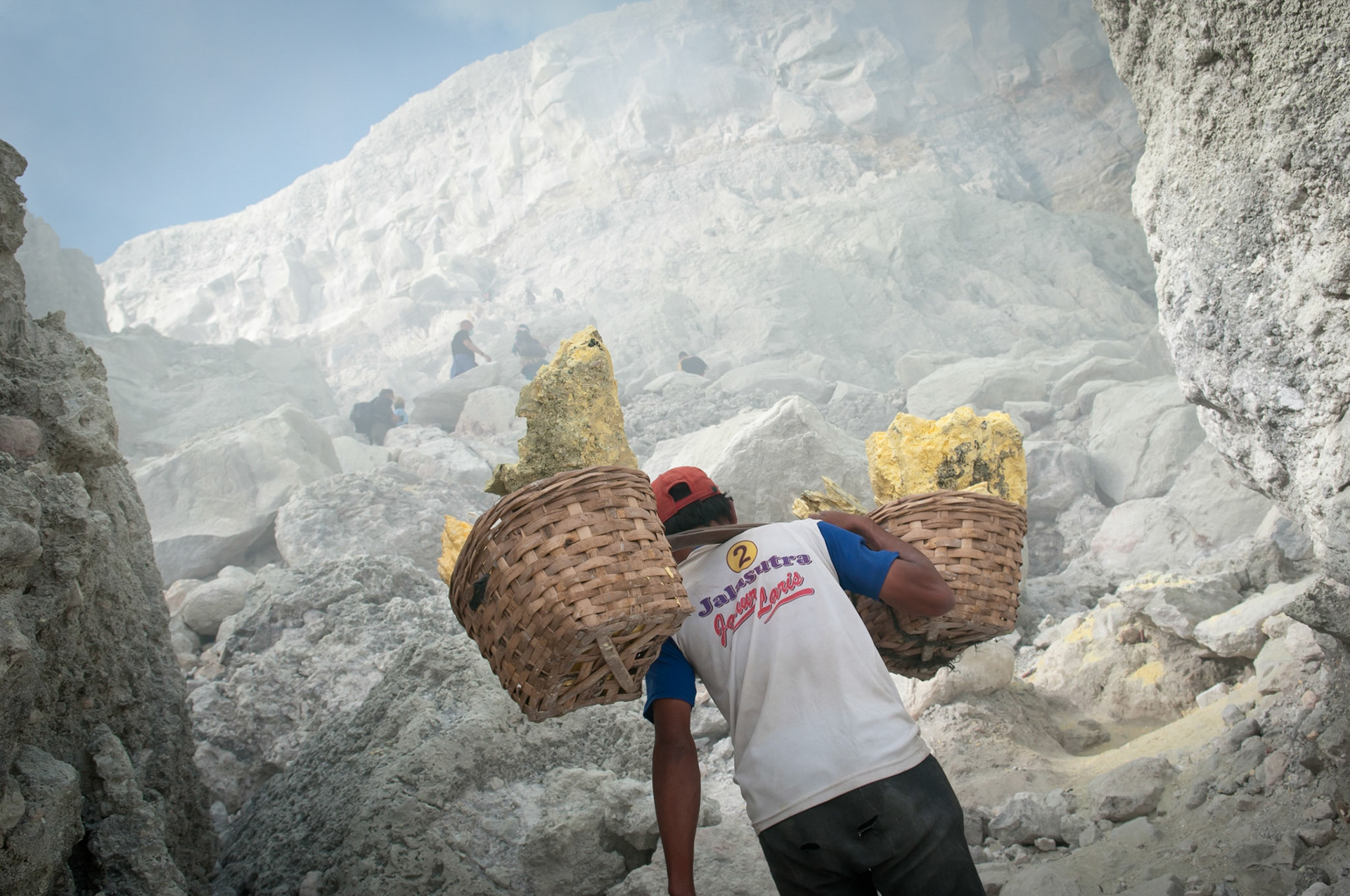 Porter climbing out of the crater (Kawah Ijen, Java, Indonesia)