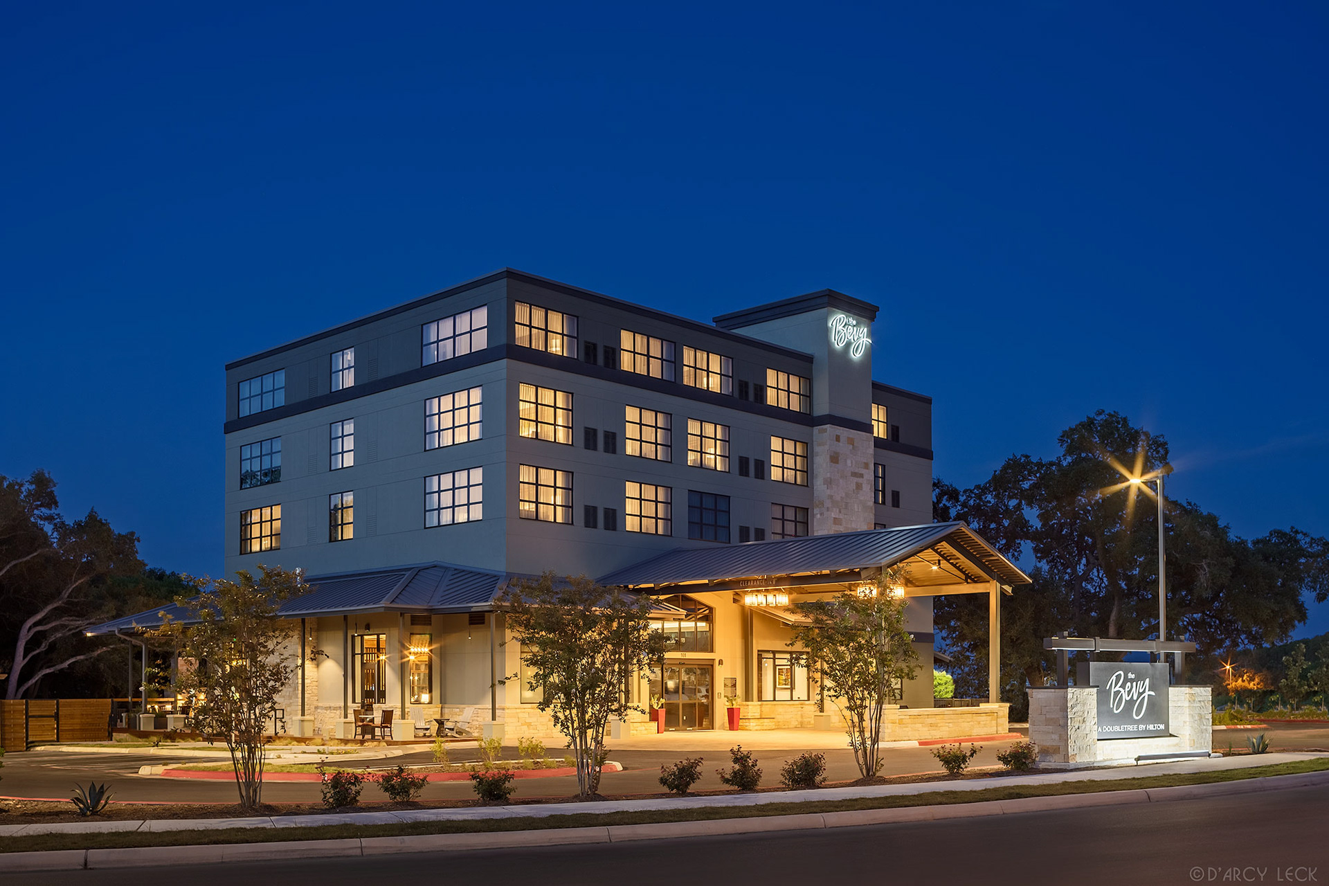 hospitality photography of the front exterior at dusk of The Bevy hotel