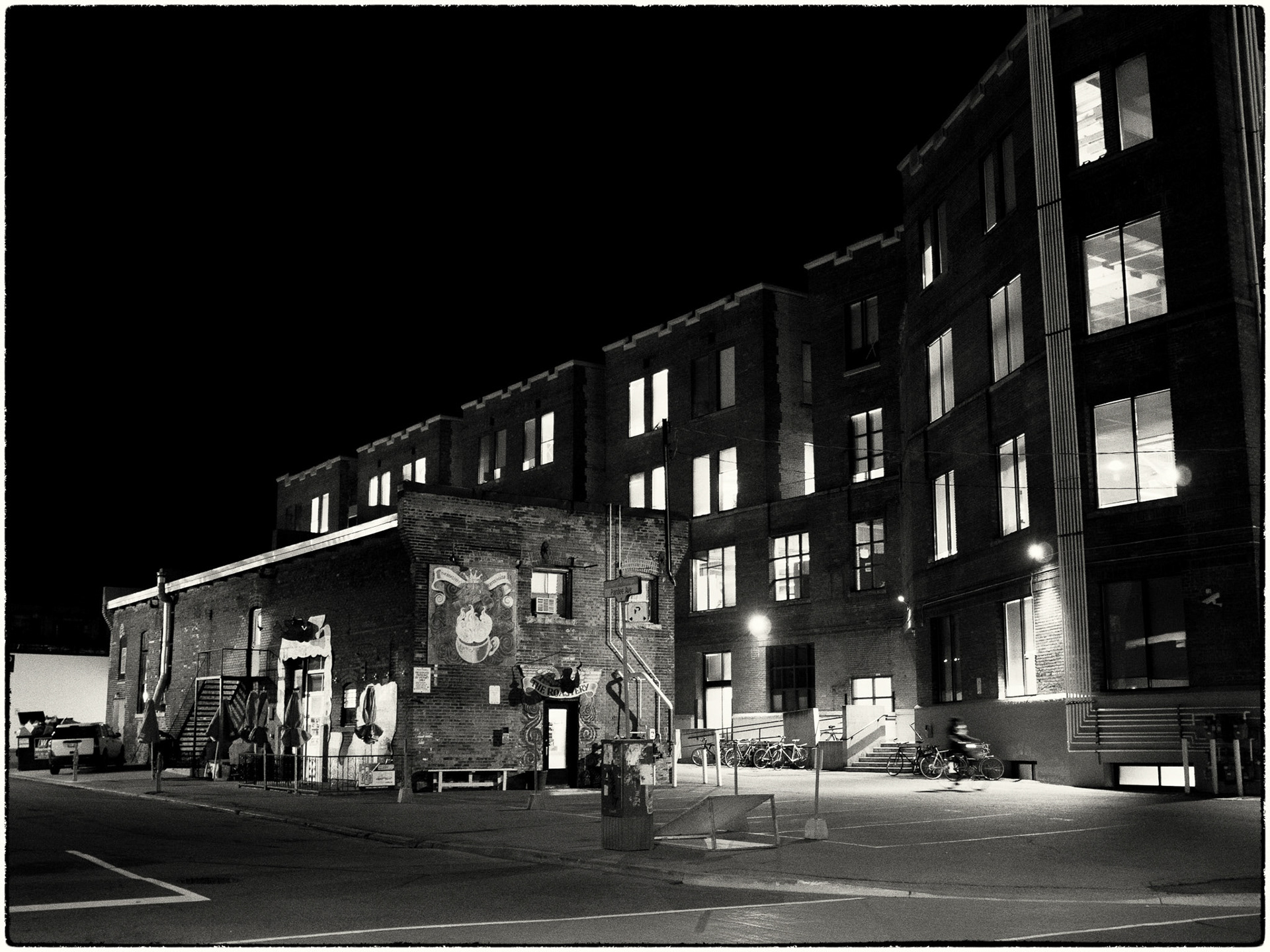 The Roastery at night, and dwarfed by the Kobo offices