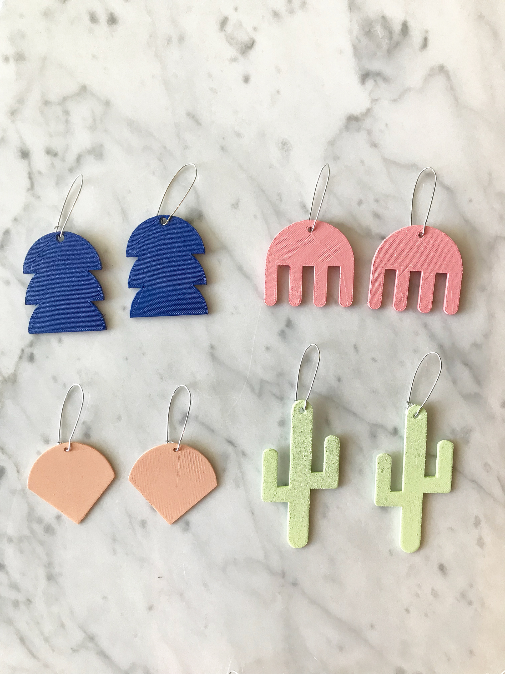 Jewelry designed, 3D printed and painted by me. Logo design also by me, in Adobe Illustrator