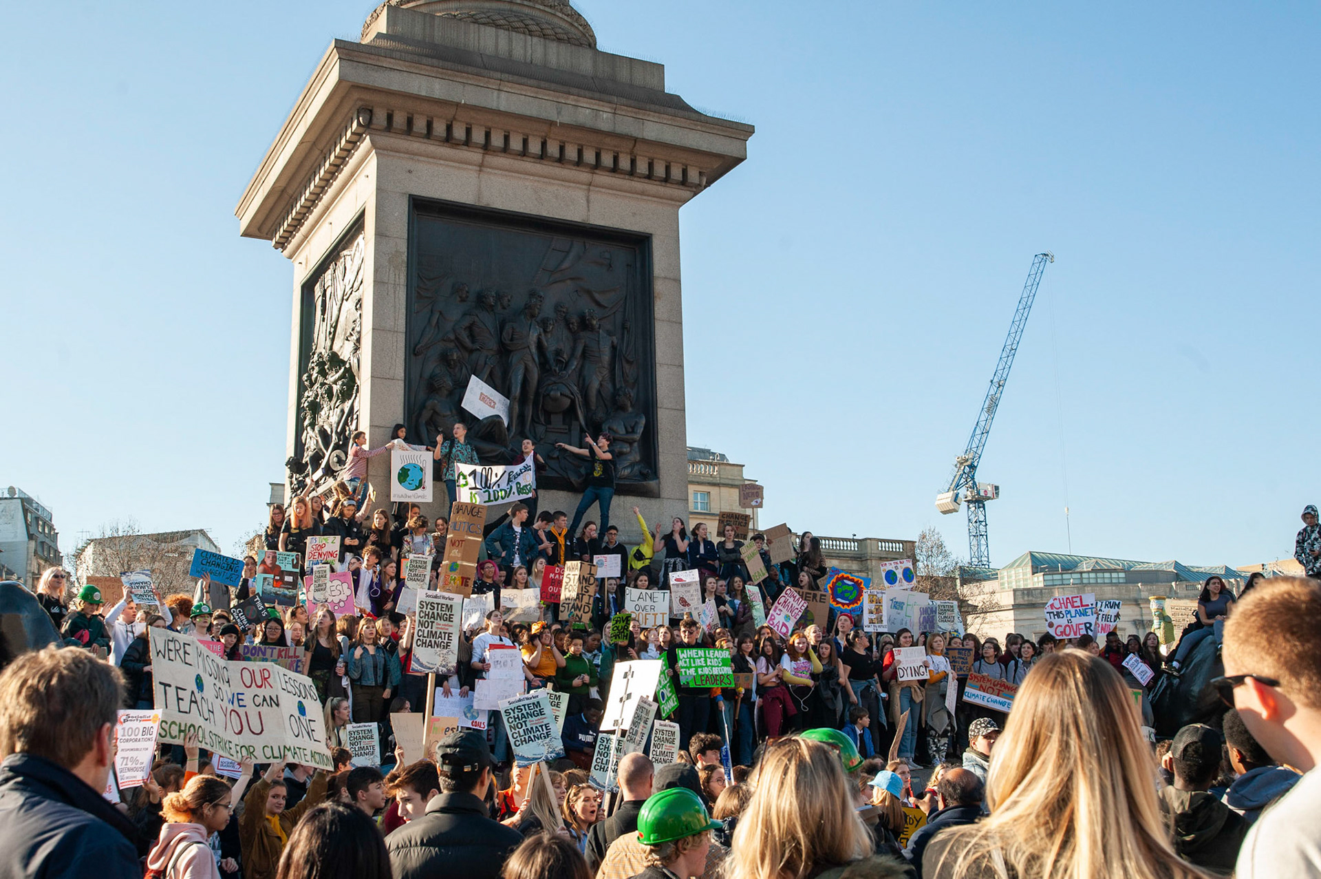 Prostesters crowd around Nelson's Column